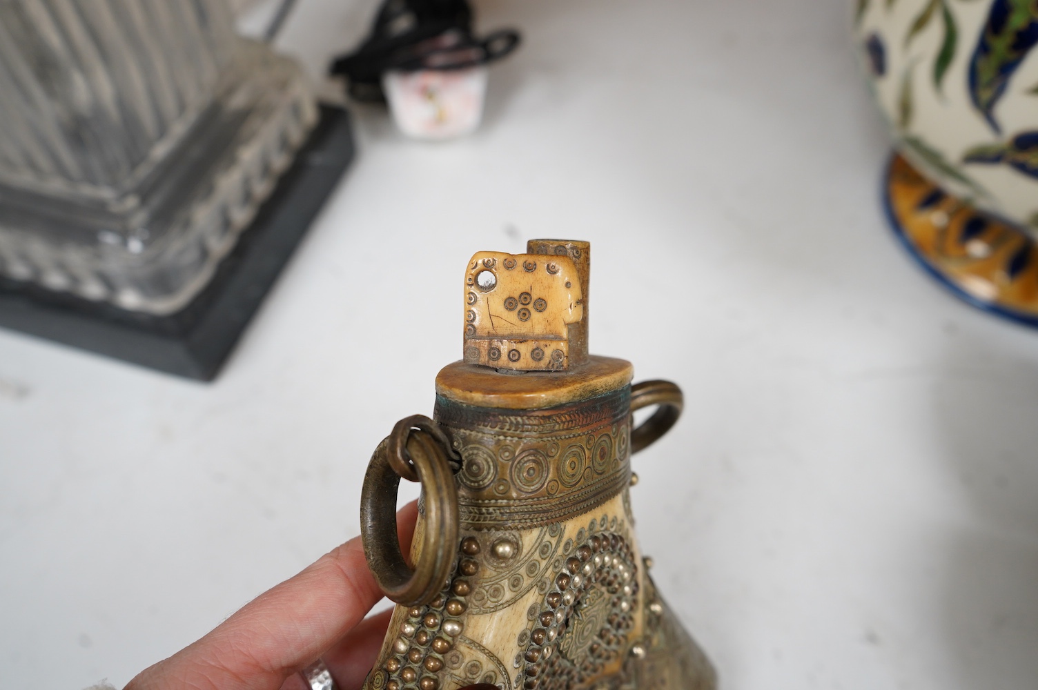 A Transylvanian brass mounted bone powder flask, 17cm high. Condition - fair to good